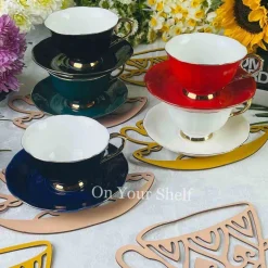 The Plain Black Teacups and Saucers